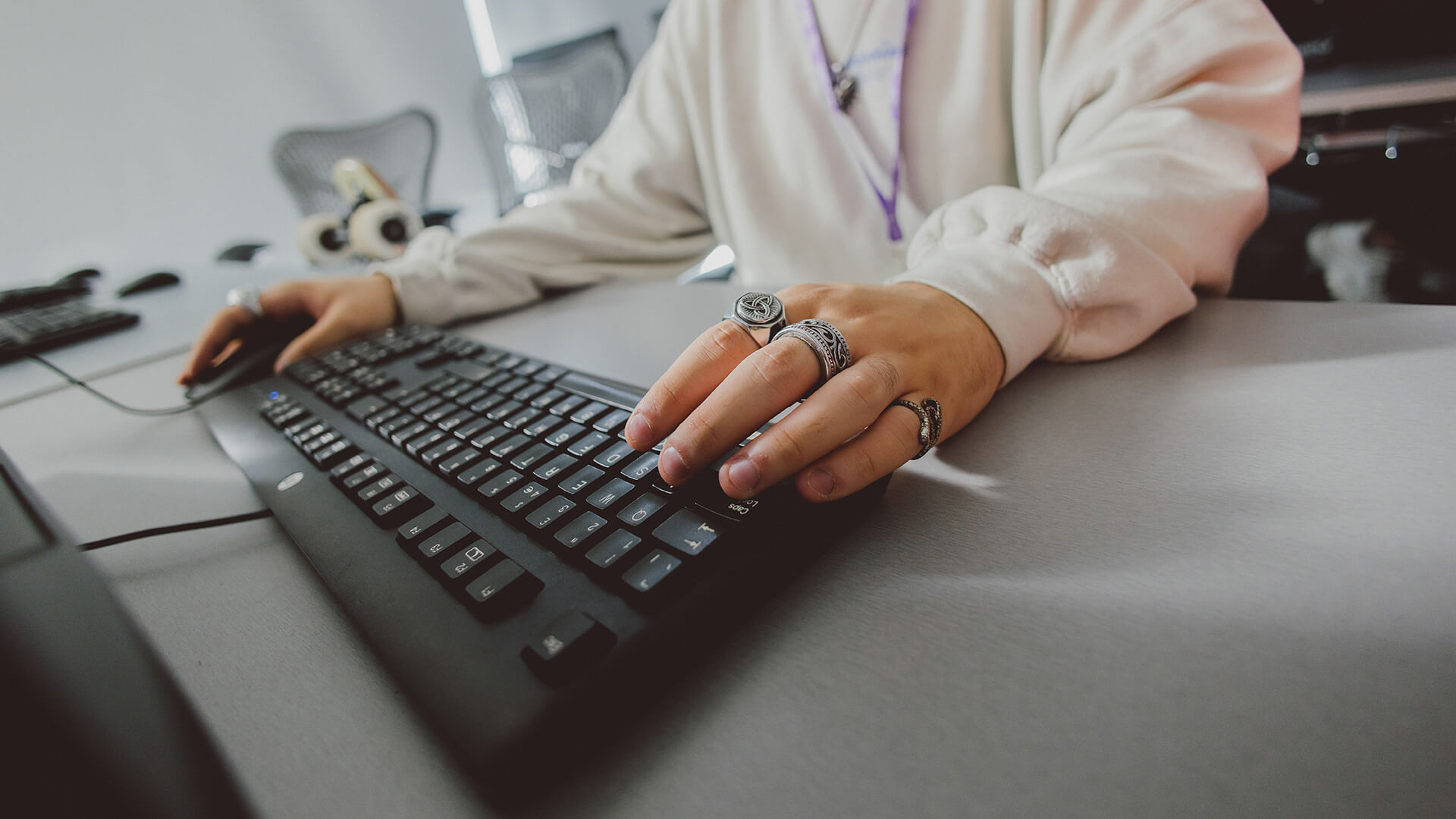 Student using a keyboard in a studio
