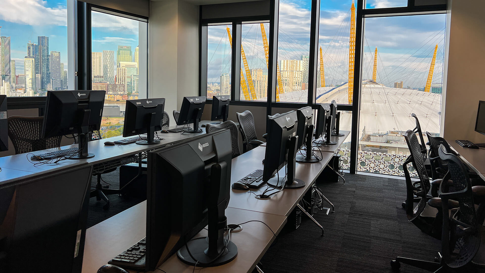 Studio at the Escape Studios campus with computers and a view of the O2 arena
