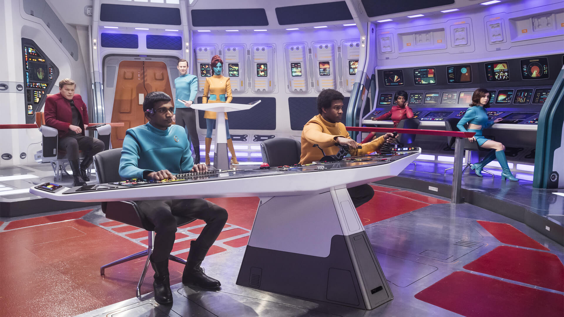 Humans and aliens on the control deck of a spaceship