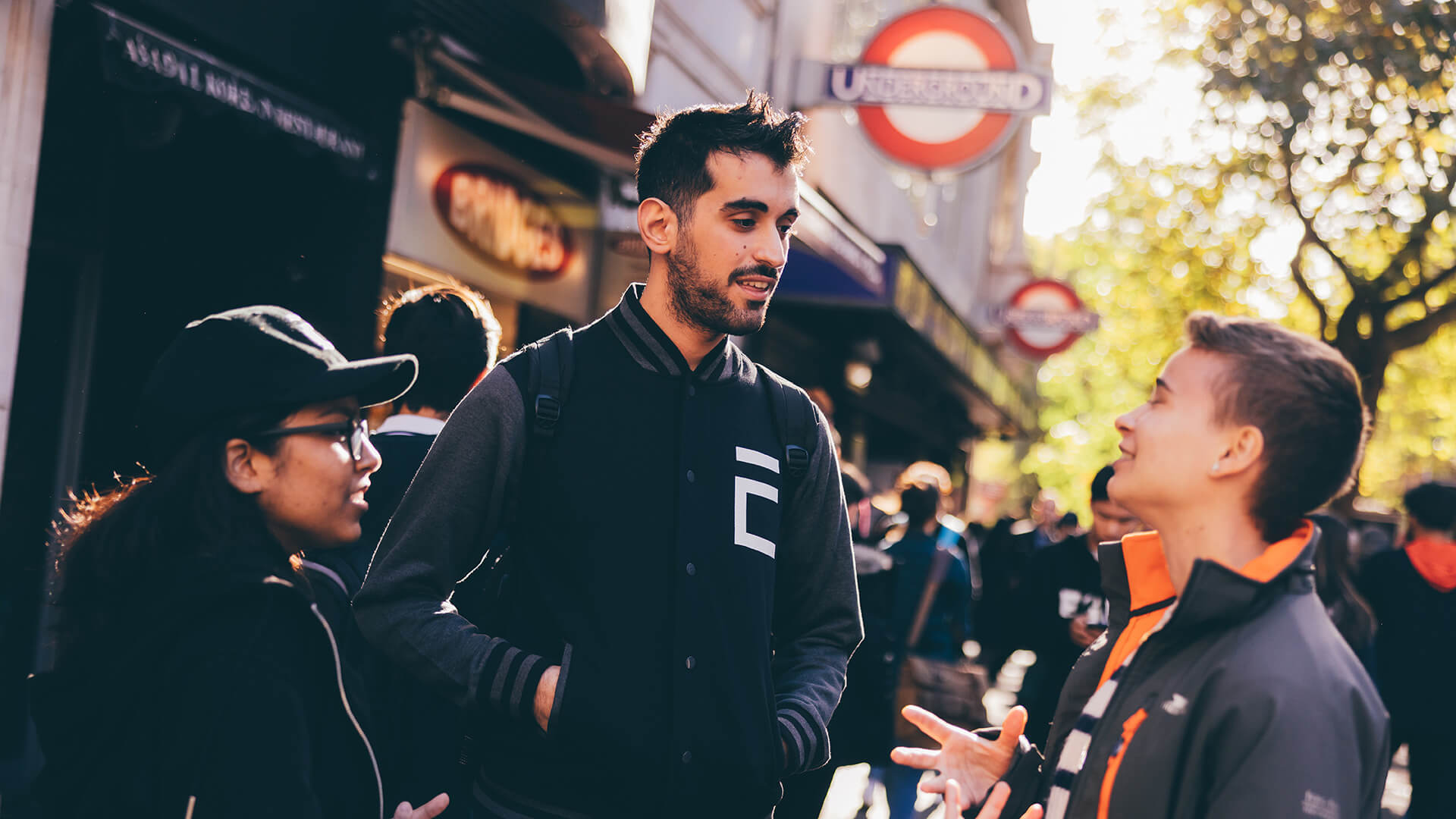 Students chatting outside underground station