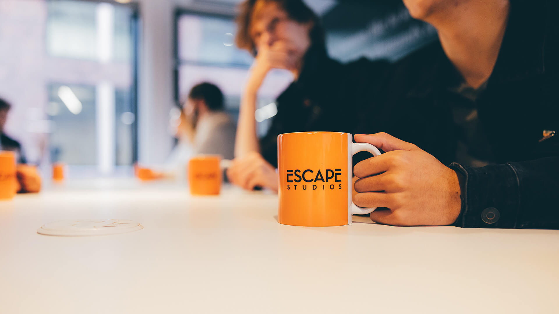 Orange coffee mug on a table